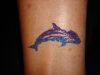 glitter shark tattoo on leg
